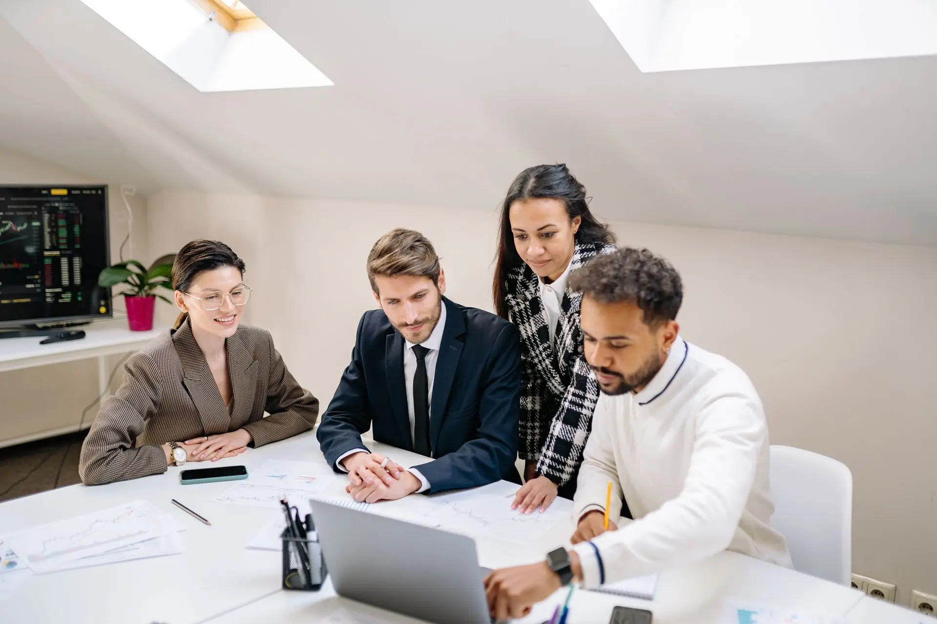Board members reviewing materials around a meeting table